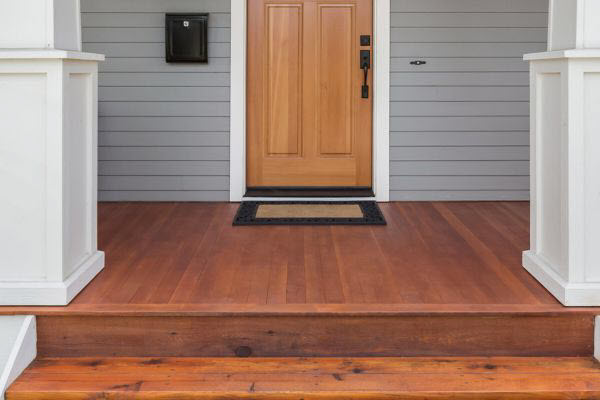 Front Porch With Timber Stairs And Decking Leading To The Front Door